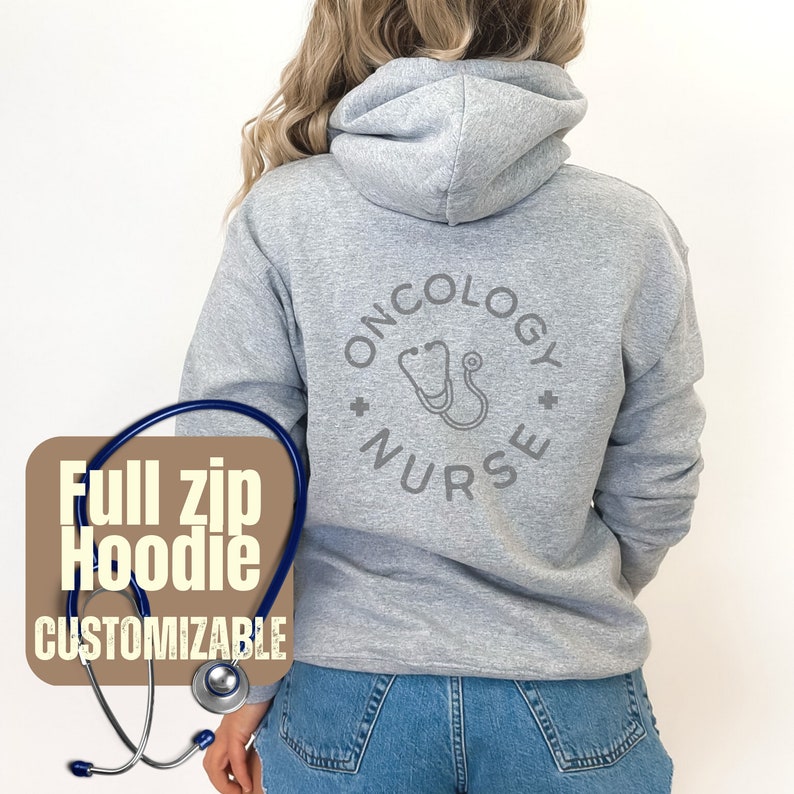 May include: Gray full zip hoodie with the text "Oncology Nurse" and a stethoscope graphic on the back. The hoodie is customizable.