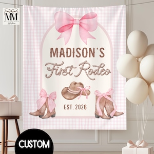May include: A pink and white gingham backdrop with the text "MADISON'S First Rodeo" and a cowboy hat and boots illustration. A large pink bow is at the top. The year "EST. 2026" is also displayed. The word "CUSTOM" is at the bottom.