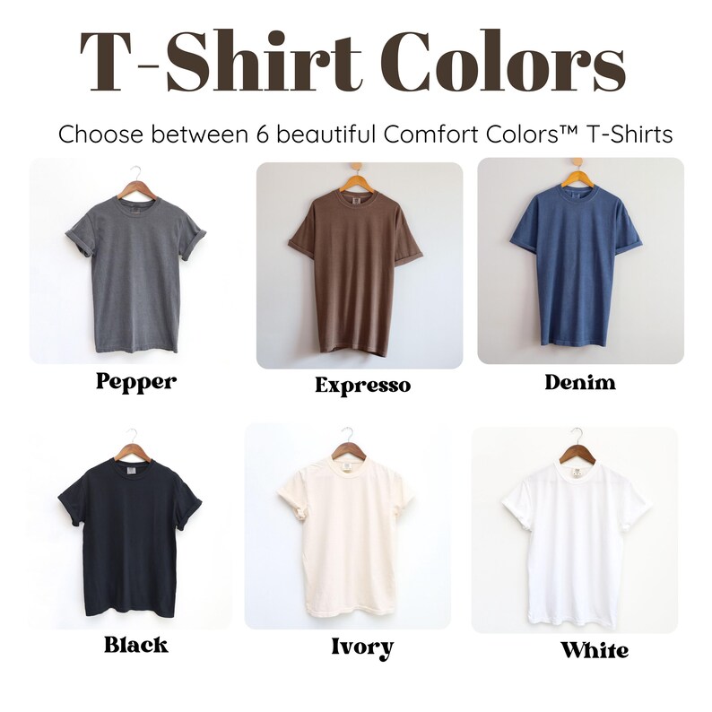 May include: Image showcasing six Comfort Colors&trade; T-shirts in various hues. The colors include Pepper, Expresso, Denim, Black, Ivory, and White. Each shirt is displayed on a wooden hanger against a neutral background. The text "T-Shirt Colors" is at the top.