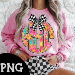 May include: Pink sweatshirt featuring a floral monogram design with the letters KSH. The monogram is surrounded by a green outline and topped with a black and white checkered bow. The sweatshirt is a solid pink color.