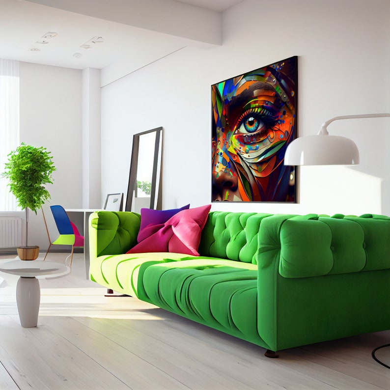 May include: A green tufted sofa with colorful pillows in a modern living room. A large abstract painting of a woman's eye hangs on the wall.