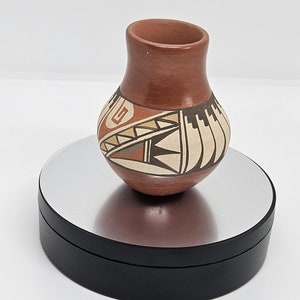 Classic Navajo Pueblo Olla with a polished slip and traditional form by Juanita Fragua of the Jemez Pueblo.