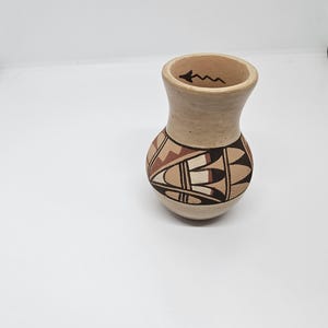 Classic Navajo Pueblo Olla with a polished slip and traditional form by Juanita Fragua of the Jemez Pueblo.