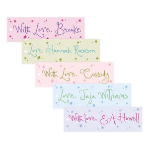 May include: Rectangular gift tags in pastel colors, each with a handwritten message and star accents. The tags read "With Love, Brooke", "Love, Hannah Rawson", "With Love, Cassidy", "Love, Juju Williams", and "With love, E A Howell".