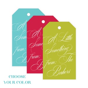 May include: Three rectangular gift tags in turquoise, magenta, and lime green, each featuring a hole at the top. The tags display white cursive text that reads A Little Something From: The Bakers. Below the tags, the text reads CHOOSE YOUR COLOR.