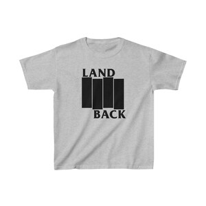 May include: A gray t-shirt with black text that reads "LAND BACK" and a black and white symbol of four vertical bars.