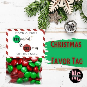 May include: A red and green candy favour bag with a tag that reads "Have a very magical & merry Christmas".