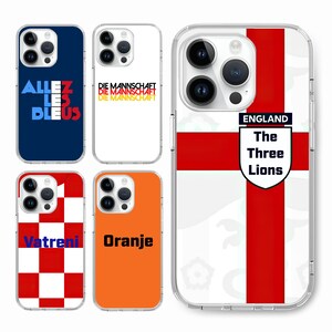 May include: Four different phone cases with national team designs. The first case is blue with white text that says "Allez Les Bleus". The second case is white with red text that says "Die Mannschaft" twice. The third case is orange with black text that says "Oranje". The fourth case is white with a red cross and a shield that says "England The Three Lions".