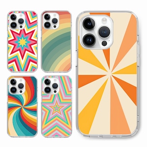 May include: Four different phone cases with retro-inspired geometric designs. The designs feature a starburst, rainbow stripes, a swirling spiral, and a star with a geometric pattern. The cases are clear and show the phone's camera lenses.