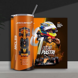 May include: Orange tumbler featuring the McLaren Formula 1 team logo and MCL39 car design. Includes a straw and a poster with Oscar Piastri, a 2025 Grand Prix winner. The tumbler has the team's logo and racing stats.