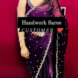 May include: A purple saree with silver embroidery and a gold trim. The saree is draped over a person and the text "Handwork Saree CUSTOMER" is visible in the image.