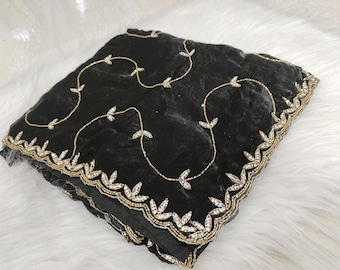 May include: Black sheer fabric scarf with gold and silver embroidery in a leaf pattern. The scarf has a scalloped edge.