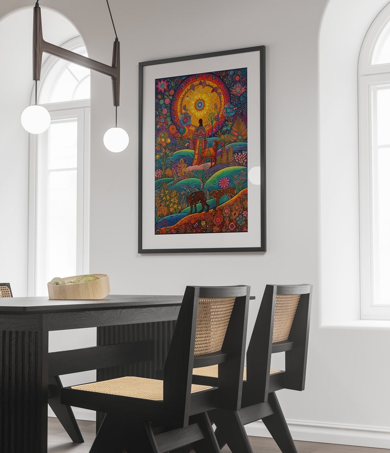 May include: A framed art print with a colourful, detailed landscape featuring a central figure and animals. The artwork has a circular sun-like element and a rich palette of blues, greens, oranges, and yellows, creating a whimsical and detailed scene.