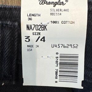May include: A Wrangler jeans tag with the brand logo and product information. The tag displays "SILVERLAKE ODESSA" jeans, size 3/4, and a length of 36 inches (91.4 cm). The material is 100% cotton. The tag also includes the text "MADE IN USA".