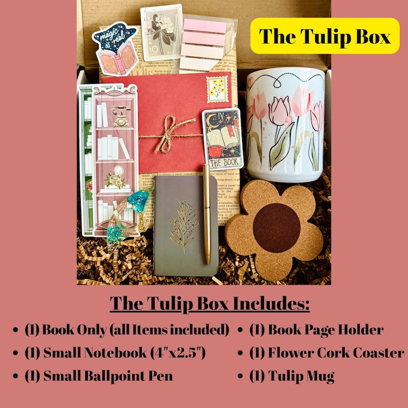 May include: A gift box labeled "The Tulip Box" filled with stationery and accessories. Includes a tulip-themed mug, a flower-shaped cork coaster, a small notebook (4"x2.5"), a pen, and other decorative items.