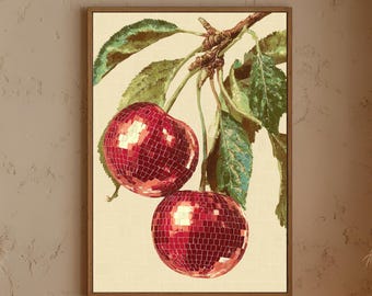 May include: A framed art print featuring two red cherries with a mosaic-like texture, hanging from a branch with green leaves. The background is a light beige color, and the frame is brown.