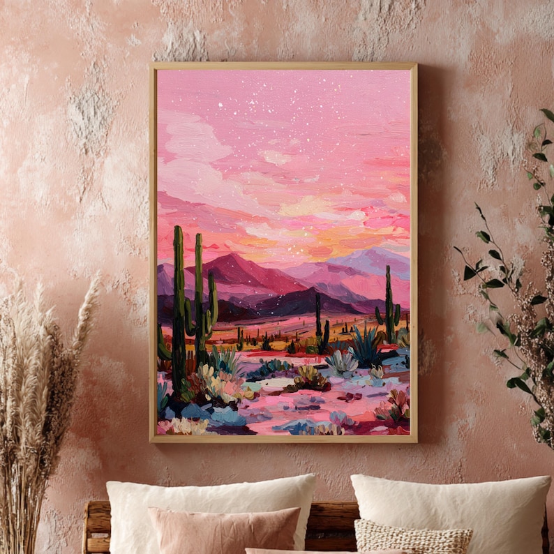 Roze desert art print met cactussen en kleurrijke bergachtergrond.