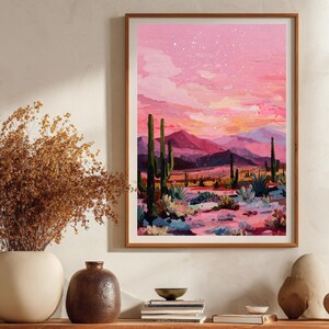 Boho wanddecoratie met cactussen en funky kleuren.