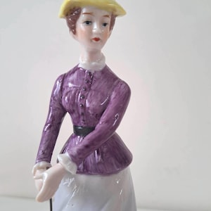 Carl Scheidig figurine of a woman playing golf