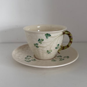 Belleek Ireland Shamrock porcelain tea cup and saucer basket weave with shamrock.
