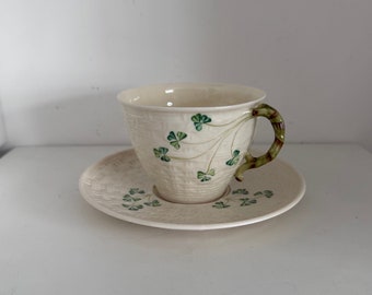 Belleek Ireland Shamrock porcelain tea cup and saucer basket weave with shamrock.