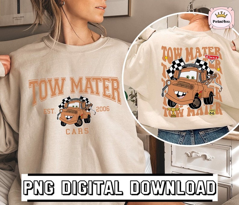 May include: A beige sweatshirt with a graphic of Tow Mater from the movie Cars. The graphic includes the text "Tow Mater", "Est. 2006", and "Cars".