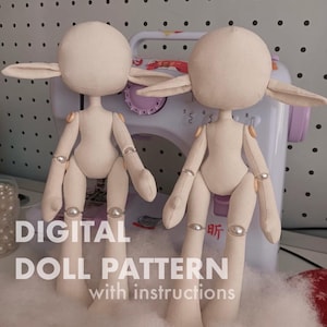 May include: Two unfinished cloth dolls with rounded heads and long ears, positioned in front of a sewing machine. The dolls have articulated limbs and are made of a light beige fabric. Text on the image reads "DIGITAL DOLL PATTERN with instructions."