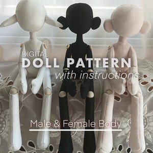 May include: Three handmade fabric dolls in white, black, and pink, with large ears and jointed limbs. The dolls are displayed against a white lace background. Text on the image reads "DIGITAL DOLL PATTERN with instructions" and "Male & Female Body".