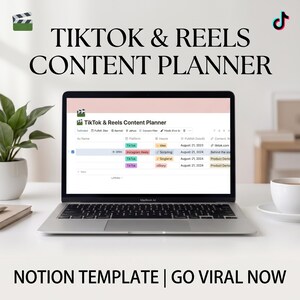 May include: A silver laptop displaying a TikTok & Reels Content Planner Notion template on its screen. The screen shows a table with columns for platform, hook, publish date, and content. The text TIKTOK & REELS CONTENT PLANNER and NOTION TEMPLATE | GO VIRAL NOW appears above and below the laptop.
