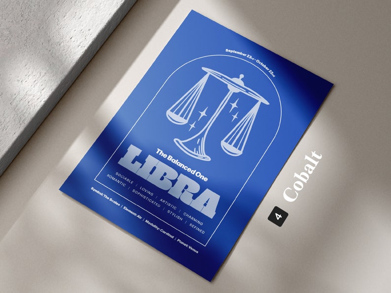 Może przedstawiać: Niebieski plakat z białą ilustracją wagi, słowem "LIBRA" w pogrubionych białych literach i tekstem "The Balanced One" nad nim. Plakat zawiera r&oacute;wnież daty "September 23rd - October 22nd", słowo "Cobalt" w białych literach i liczbę "4" w białym k&oacute;łku.