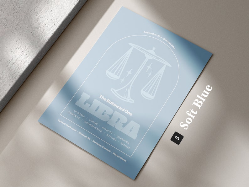 Może przedstawiać: Jasnoniebieski plakat z białym obrysem wagi i słowem "LIBRA" w pogrubionych białych literach. Tekst "The Balanced One" znajduje się nad wagą, a daty "September 23rd - October 22nd" znajdują się nad tekstem. Tekst "Soft Blue" znajduje się w prawym dolnym rogu plakatu z numerem "3" w czarnym k&oacute;łku.