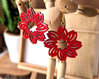 Round wooden hoop earrings in the shape of a red flower