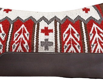 May include: A brown, red, white, and gray saddle pad with a leather strip across the center. The saddle pad has a geometric pattern with crosses and leaves.