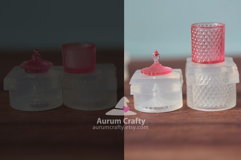 May include: Four clear glass containers with pink lids. The containers are of different shapes and sizes. The lids are all decorated with a diamond pattern.