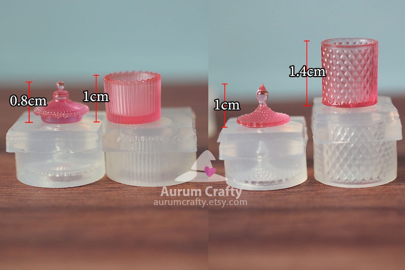 May include: Three clear silicone moulds for making miniature glass jars with lids. The moulds are 1 cm in diameter and 1.4 cm tall. The jars are pink and have a diamond pattern.