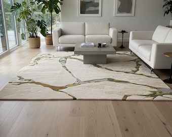 May include: A modern living room featuring a cream-colored rug with a nature-inspired design in shades of green and brown. Two white sofas face a square concrete coffee table. Large windows and potted plants add to the bright, airy feel.