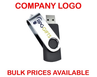 Puede incluir: Una memoria USB plateada y negra con una etiqueta blanca que dice "RPG Gifts". El texto "SEND YOUR COMPANY LOGO" está en rojo en la parte superior de la imagen y el texto "BULK PRICES AVAILABLE ON REQUEST" está en rojo en la parte inferior de la imagen.