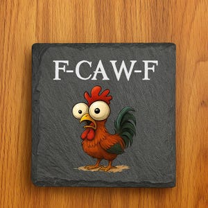 May include: A square, dark gray slate coaster with the text "F-CAW-F" in white. The coaster features a cartoon rooster with wide eyes, a red comb, and a green tail. The rooster appears surprised.