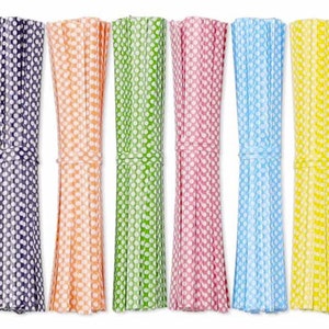 May include: Ten bundles of colorful polka dot ribbon, each bundle tied with a white string. The ribbons are pink, purple, orange, green, red, light blue, yellow, and red.