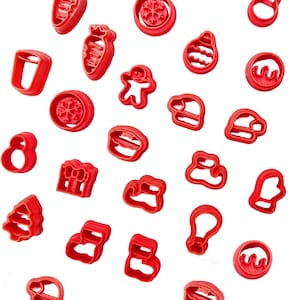 May include: A selection of red plastic cookie cutters in festive shapes, such as a Christmas tree, gingerbread man, snowflake, and stocking. The cutters are arranged on a white background, perfect for seasonal baking.