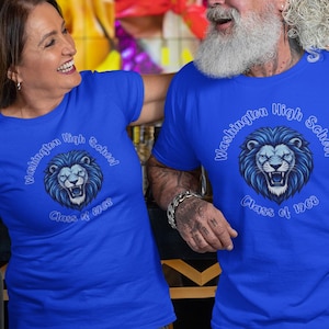 May include: Two royal blue short-sleeve t-shirts featuring a graphic of a roaring lion head in the center. The text "Washington High School" is arched above the lion, and "Class of 1988" is printed below the lion in a light blue font.