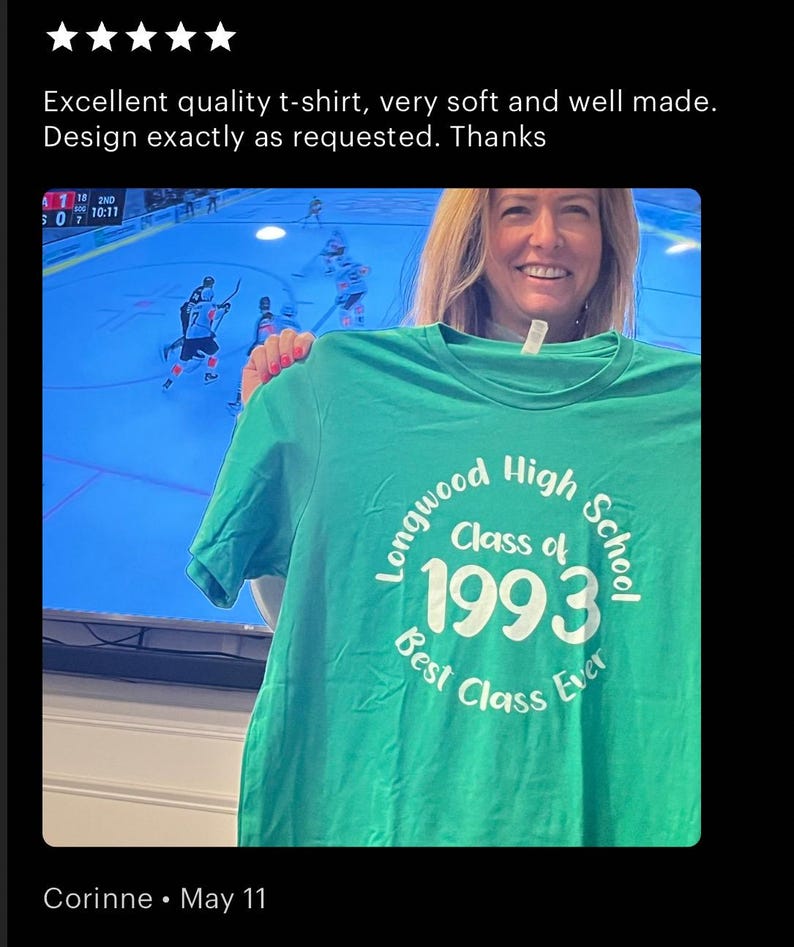 May include: Green t-shirt with white text that reads "Longwood High School Class of 1993 Best Class Ever".