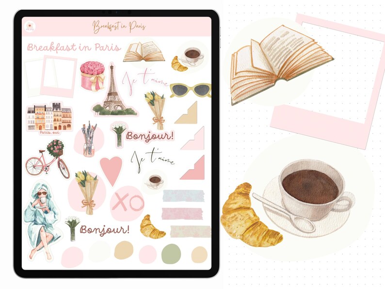 May include: A digital planner page with stickers featuring Parisian themes. The stickers include a croissant, a cup of coffee, a book, a heart, flowers, and the words "Bonjour!" and "Je t'aime".