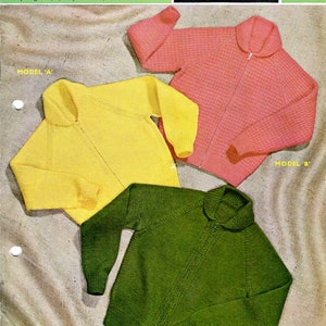May include: Three knitted sweaters in yellow, pink, and green. The sweaters are all the same style, with a zipper up the front and a collar. The text on the label reads "arctic moss, double knitting wool, double crepe wool, tricel nylon, top line nylon, courtelle crepe, boy or girl 6/8/10 years 26/30", 9 to 14 balls, 686 B, SIRDAR, 7 1/2p, Model 'A', Model 'B', Model 'C'.