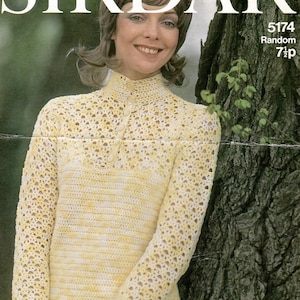 May include: A yellow and white crocheted sweater with a high neckline and long sleeves. The sweater has a textured pattern and is worn by a woman with brown hair. The image also includes the text "5174 Random 71p".