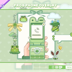 May include: Green frog phone overlay with a green flip phone, frog stickers, and a frog charm. The phone has a green screen with a phone icon and the text "Incoming call..." The overlay is on a green background with a white pattern.