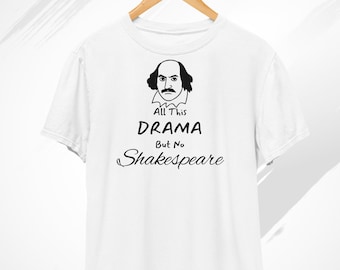 May include: White t-shirt with a black graphic of William Shakespeare's face and the text "All This Drama But No Shakespeare." The shirt is hanging on a wooden hanger against a white background.