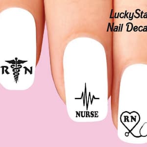 May include: Nail decals featuring medical symbols and text. Designs include a caduceus with "RN", a heartbeat line with "NURSE", and a heart-shaped RN with a stethoscope. The text "LuckyStar Nail Decals" is also visible.