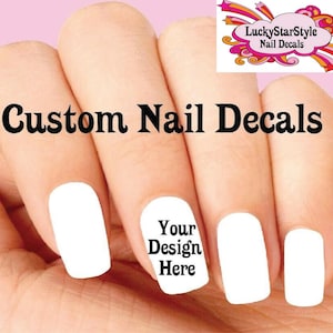 May include: A hand with white nail polish, with the text "Custom Nail Decals" and "Your Design Here". The image also includes a logo that says "LuckyStarStyle Nail Decals".