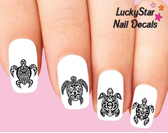 May include: Nail decals featuring black turtle designs on white nail polish. The turtles have intricate tribal patterns. The image includes the text "LuckyStar Nail Decals" in black and pink.